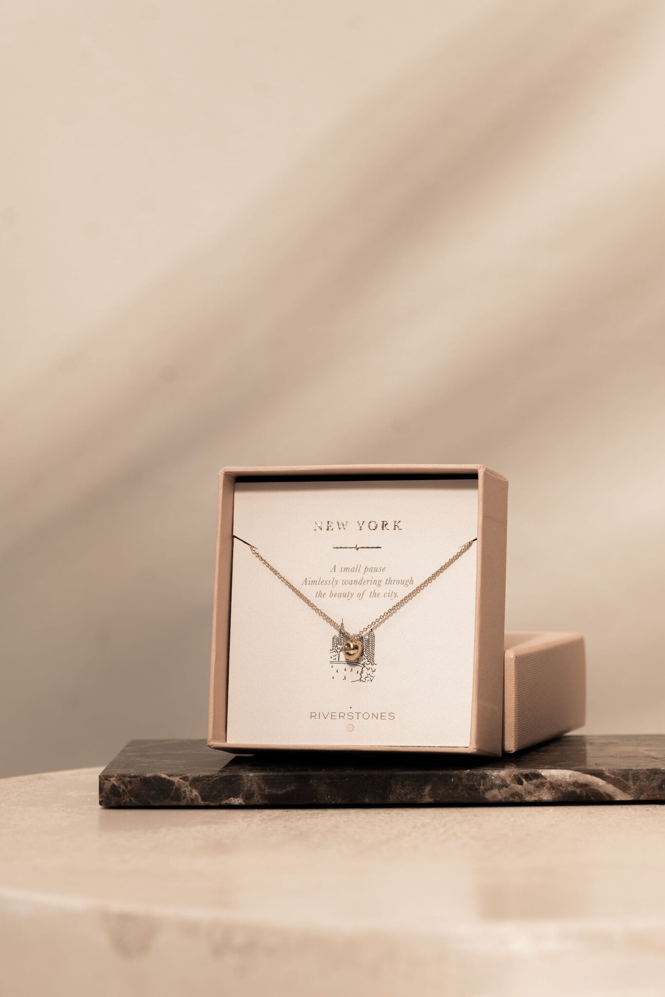 Apple necklace new york still