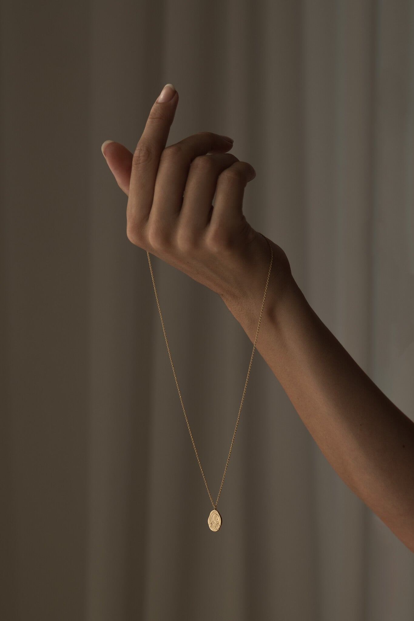 Cosmos necklace hand